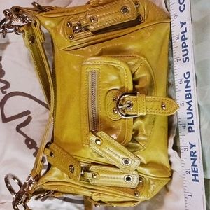 Junior Drake shoulder bag.  Small, dark mustard color.